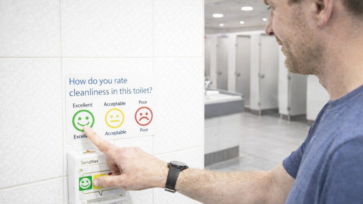 Toilet feedback terminal for restroom hygiene monitoring with smiley buttons